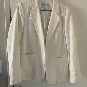This Linen white jacket is good to dress up any occasion.